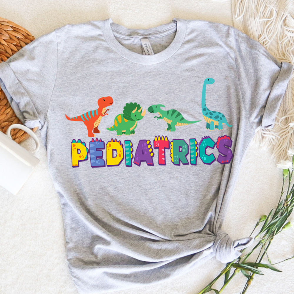 Pediatric Nurse Graphic Tee Dinosaurs Pediatrics